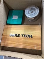 Wooden Carb-Tech box and two additional containers in a cardboard box
