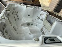 View of the Sundance hot tub's interior seating and multiple jet nozzles.