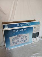 Front view of the Bionaire Digital Window Fan box showing the product image, brand, and key features.