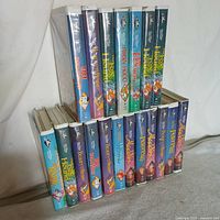 Photo showing 19 Disney Black Diamond VHS tapes arranged in two rows, highlighting titles: The Fox and The Hound, Robin Hood, The Rescuers, 101 Dalmatians, Beauty and the Beast, Aladdin, Peter Pan, and The Little Mermaid.