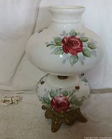 Full view of vintage night stand lamp showing floral design and metal base