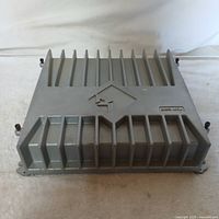 Top view photo of the Rockford Fosgate amplifier showing the heat sink fins and branding on the casing.