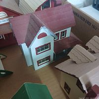 Top view of a few of the miniature buildings showing detailed roofs and walls with painted windows.
