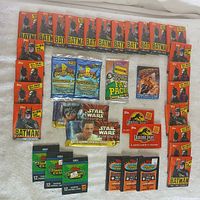 Full lot arrangement showing all unopened wax packs including 22 Batman, 2 Power Rangers, 2 Star Wars, 2 Jurassic Park, 1 Fat Pack, 1 Last Action Hero, 3 1991 Stadium Club, and 3 1992 Stadium Club packs.