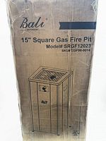 Original closed cardboard packaging box showing brand Bali Outdoors and model SRGF12023 with an illustration of the fire pit.