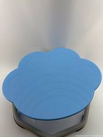 Top angled view showing blue cat paw shaped seat with wrap and texture details