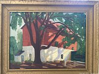 Front view of vintage oil painting showing a red barn, a large tree with green foliage, and a white building, with wooden decorative frame.
