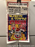 Full view of the vintage circus poster showing event details and colorful clown artwork.