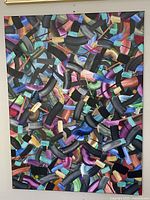Full view of the abstract acrylic painting showing colorful broad brushstrokes overlapping on board.