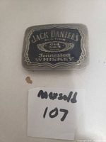 Front side of Jack Daniel's belt buckle showing logo and design details.