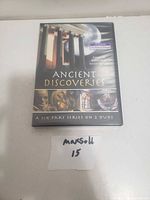 Front cover of Ancient Discoveries DVD case showing title and artwork of ancient history visuals.