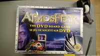 Photo of the Atmosfear DVD board game box showing front cover artwork and branding.