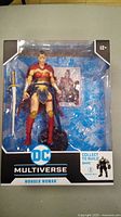 Wonder Woman figure in original packaging, showing figure, accessories, and collectible card.