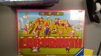 Sealed Super Mario Labyrinth board game box showing the front with characters and maze illustration.