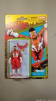 Sealed Marvel Legends Falcon action figure in original blister pack featuring comic art and included red falcon bird accessory.