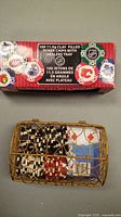 Boxed NHL clay-filled poker chips set and metal dealer tray with random poker chips and playing cards.