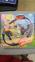 Photo of the front of the Nintendo Switch Ring Fit Adventure game box showing the Ring-Con accessory and game artwork.