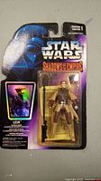 Star Wars Shadows of the Empire Leia Organa action figure in original packaging showing figure and blaster accessory.