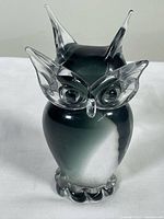 Front view of the Murano glass owl showing gradient green to clear glass body with clear detailed glass eyes, beak, and ear tufts.