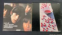 Front cover of The Rolling Stones 'Out of Our Heads' vinyl album showing band members' faces in monochrome.