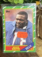Front of the 1986 Topps Bruce Smith rookie card showing player photo, team, position, and price sticker.