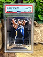 Front of 2019 Panini Prizm Zion Williamson rookie card graded PSA 10 Gem Mint in protective plastic casing showing player action image and PSA label.