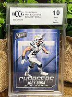 Front of Joey Bosa football card graded BCCG 10 Mint or Better, showing player image and Chargers branding.