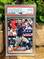 Front of 2018 Topps Update Ronald Acuna Jr baseball card graded PSA 10 showing player batting in blue jersey.