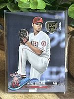 Front of Shohei Ohtani rookie card with RC medallion logo, showing player in pitching stance, dressed in Angels uniform and cap.