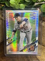 Front of Tarik Skubal rookie card showing player pitching in Tigers uniform with rainbow prism pattern.