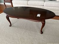 Full front view of oval tabletop and legs