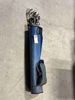 Full view of the blue Proline junior golf bag holding the clubs, showing bag condition and design.