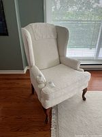 Front left perspective of wingback armchair