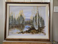 Full view of the signed framed original painting depicting wetland landscape with birch trees and reflections in water, showing overall condition and framing.