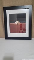 Front view of photographic print of Blond Labrador in black wooden frame with double matting.
