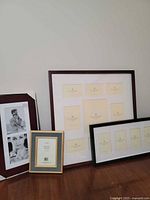 Four picture frames arranged together showing different sizes and finishes.