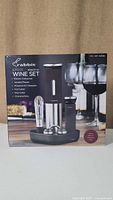 Front of the sealed boxed Rabbit 8-piece electric wine set with image of items included