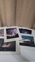 Set of five original photographic prints with matting, laid out showing variety of images including nature and abstract themes.