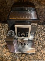 Front view showing control panel, bean hopper hopper lid and drip tray