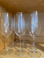 Set of six clear lead-free crystal wine glasses with long stems, large bowls for red or white wine.