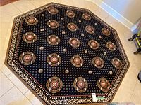 Full top-down view of the hexagonal rug showing overall shape and medallion pattern