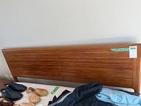 Frontal view of headboard showing wood grain finish