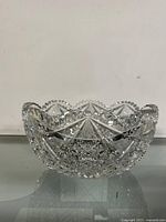 Side view showing the detailed cut glass patterns and shape of the bowl