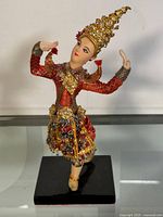 Front view of the Thai dancing figurine showing detailed traditional attire and pose.