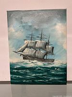 Full view of the oil painting showing a multi-masted sailing ship with white sails on choppy green-blue ocean under cloudy sky, signed in lower right.