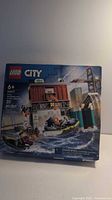 Front of box showing LEGO City logo, set number 60417, age 6+, 311 pieces, image of harbor patrol boat and dock structure.