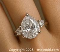 Front view of pear-shaped lab-grown diamond ring on finger