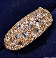 Close-up front view showing morganite stones set in silver ring top