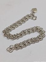 Photo of the silver double-row linked bracelet lying flat showing clasp and chain design
