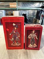 Two pirate figurine boxes, red packaging showing front images of figures inside